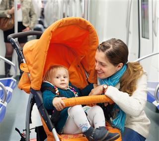 Woman With Child In Stroller