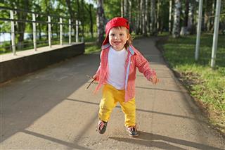 Happy Baby Boy Running Outdoors