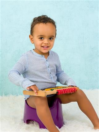 Smiling Toddler On Potty