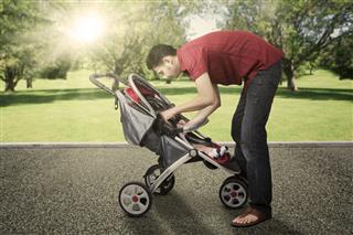 Man And Baby With Stroller