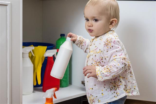 Girl Playing With Household Cleaners