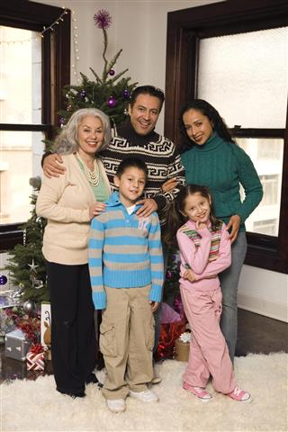 Hispanic family portrait at christmas time
