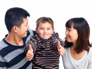 Asian Child With His Parents