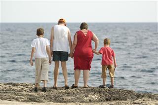 Family together looking at the sea