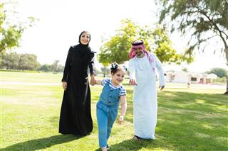 Happiness family walking in the park in saudi arabia