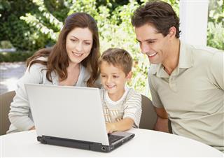 A family working together at a computer