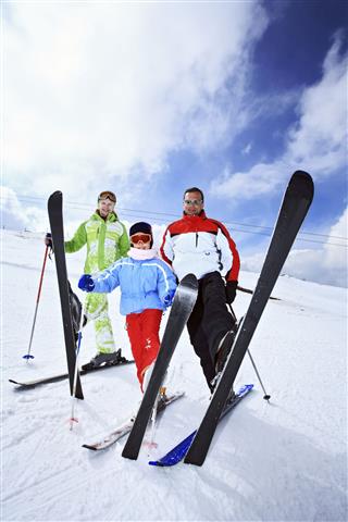 Happy Family On Ski Resort