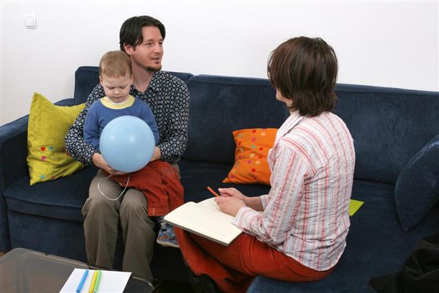 Father and son visit a social worker
