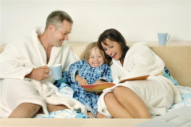 Happy Family in Bed