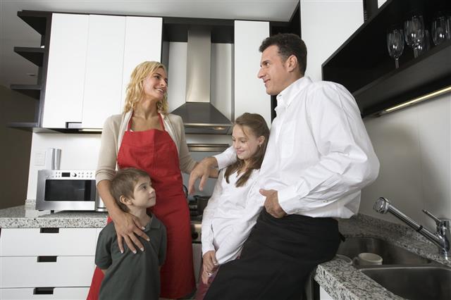 Happy Family In Kitchen