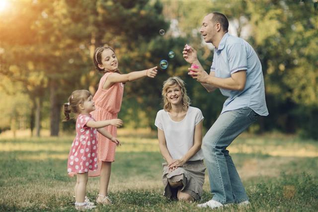 Family Having Fun With Bubbles
