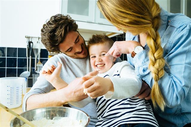 Happy Family Having Fun While Preparing Food Together