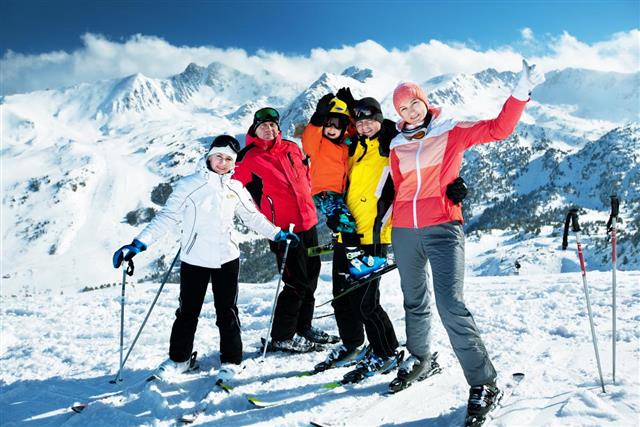 Happy family enjoying winter vacations in mountains