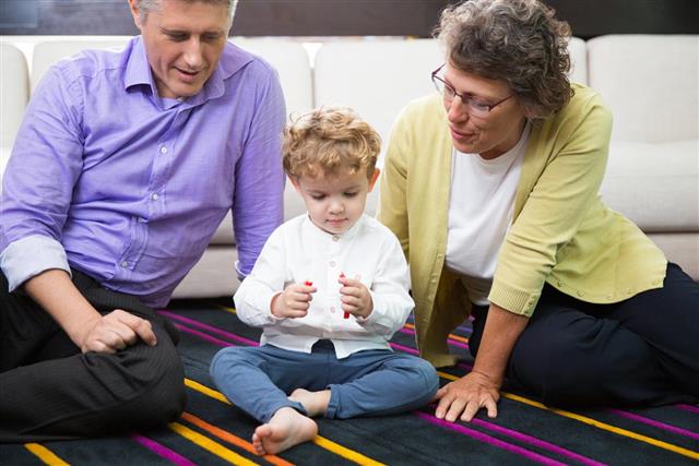 Grandmother, Dad and Little Boy Sitting on Floor