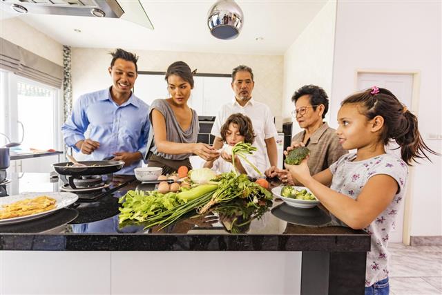 Three Generation Asian Family Cooking Healthy Food Together