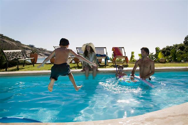 Family playing in swimming pool
