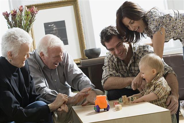 Little boy with parents and grandparents
