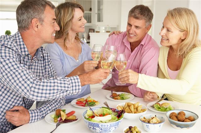 Couples Enjoying Meal At Home