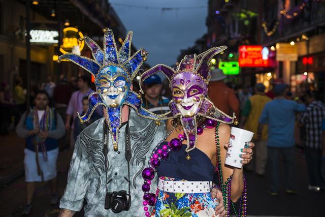 People Wearing Mardi Gras Masks