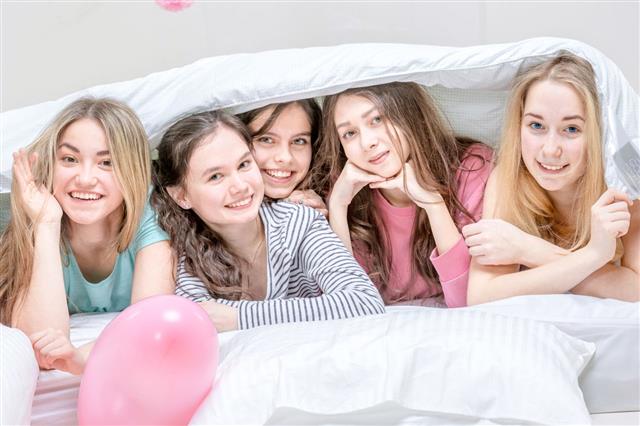 Teenage Secrets Under Blanket