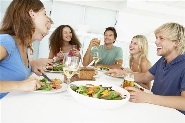 Smiling Group Eating Vegetable Lunch