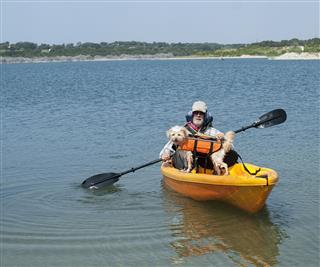 Senior And Dog Kayaking