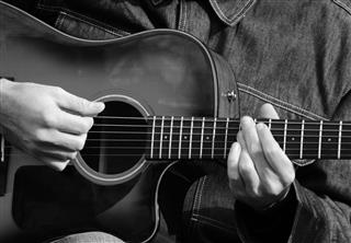 Male Hands Playing Guitar