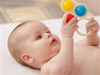 Cute Baby Playing With A Toy