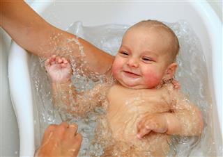 Cute Baby Boy Enjoying Bath