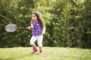 Little Girl Playing Badminton