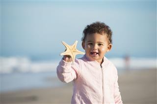 Toddler Girl Showing Starfish