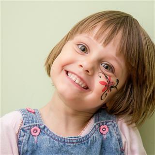 Little Girl With Flower Face Paint