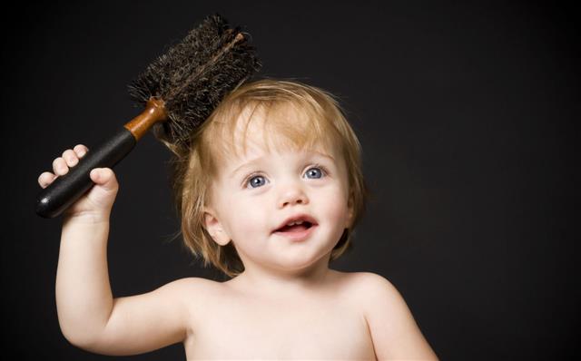 Baby Girl Brushing Her Hair