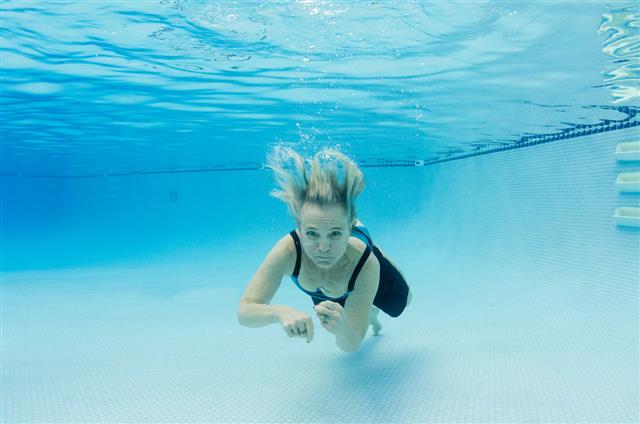 Underwater Swimming Of Retired Woman