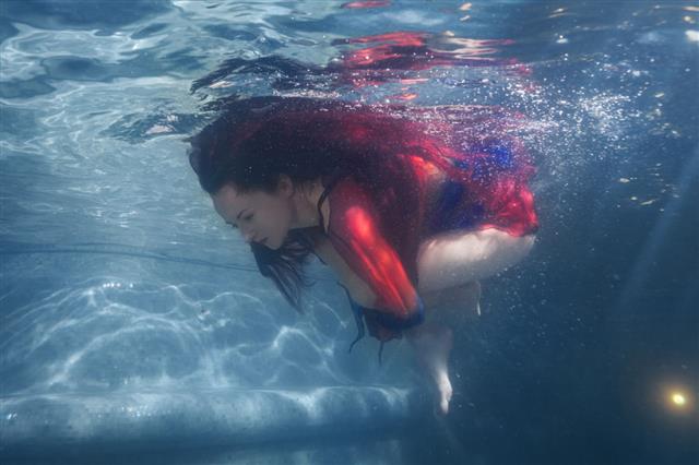 Woman Makes Splashes Underwater