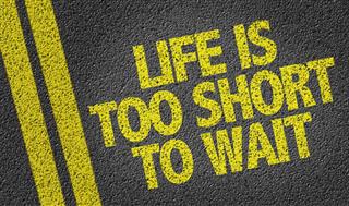 Life is Too Short To Wait written on the road