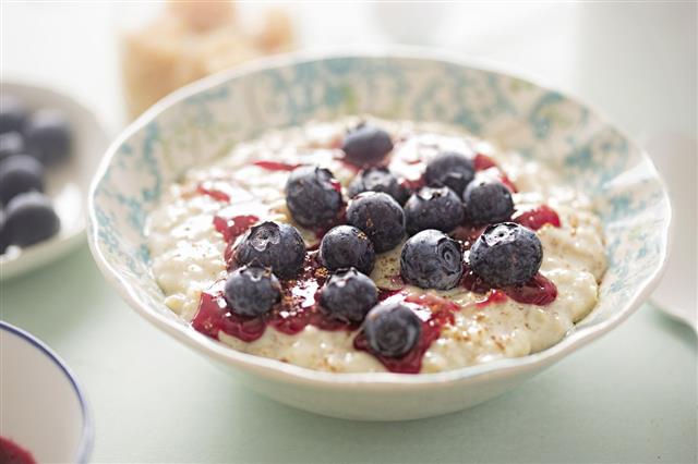 Porridge With Berry Sauce And Blueberries