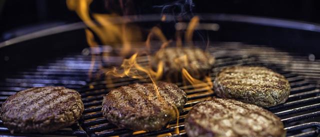 Meat Patties On A Barbecue