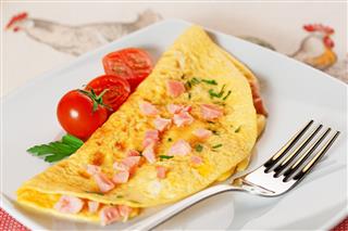 Omelette With Ham And Cherry Tomatoes