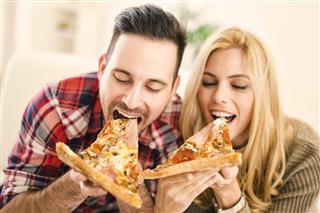 Couple Eating Pizza