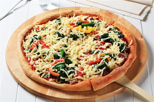 Pizza With Vegetables And Grated Cheese