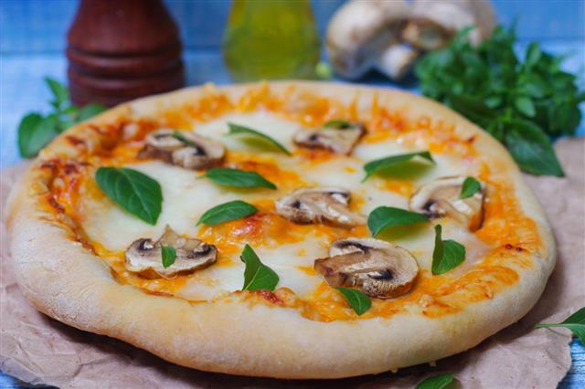 Delicious Pizza With Mushrooms And Basil