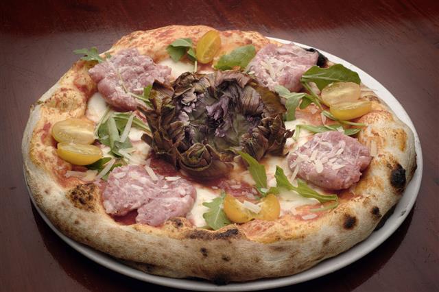 Italian Pizza With Vegetables And Sausages
