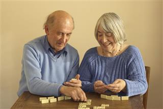 Senior Couple Playing Dominoes