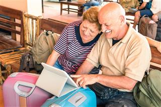 Couple Sitting With Digital Laptop