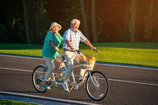Senior Couple Rides Tandem Bike