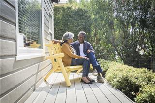 Senior Couple Sitting In Porch