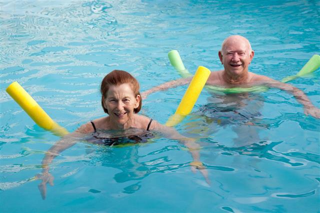 Senior Woman Man In Swimming Pool
