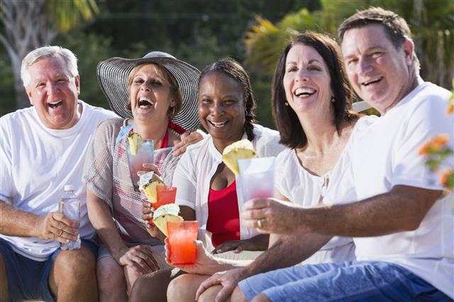 Mature Adults Enjoying Tropical Drinks