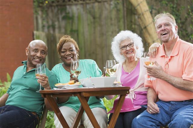 Group Of Seniors Enjoying Wine